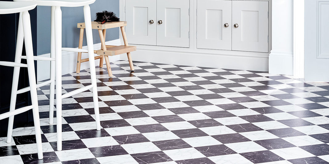 Black and white checkered flooring in a kitchen
