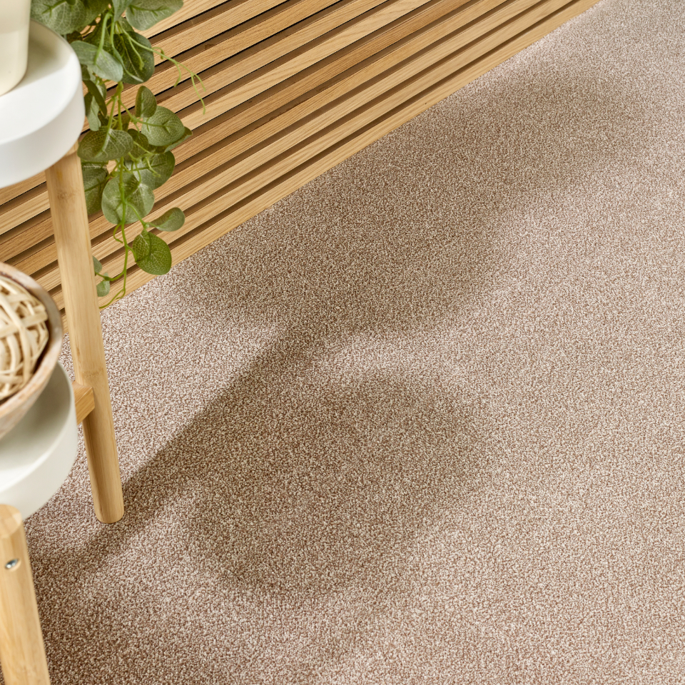 Caerphilly twist pile carpet with a sidetable on the carpet