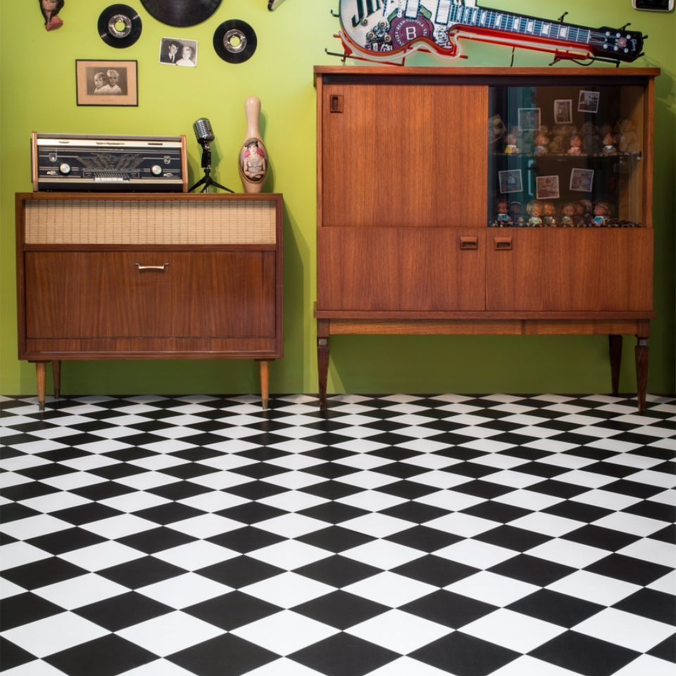 Black and white tile ffect vinyl in room with sideboards