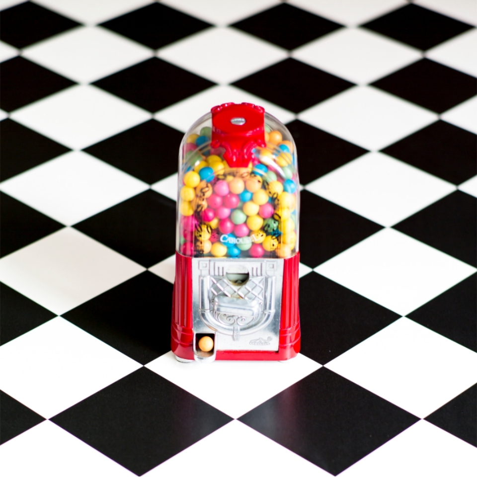 Black and white tile ffect vinyl close up with gumball machine