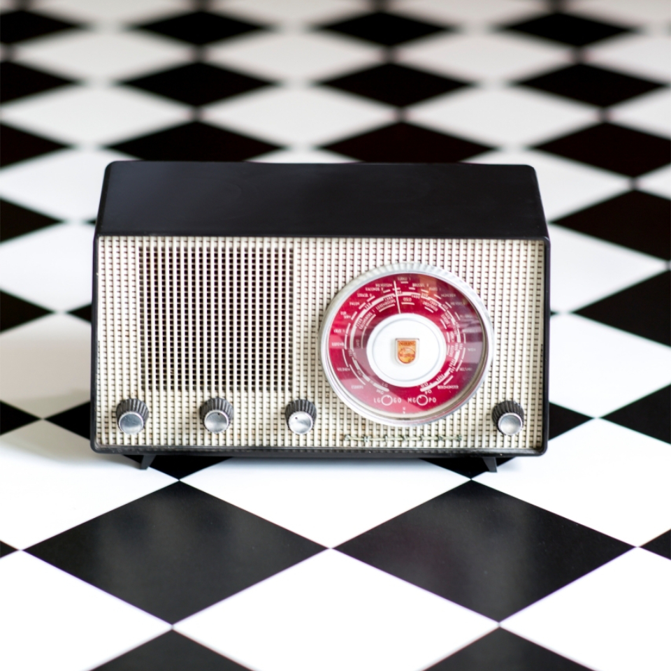 Black and white tile ffect vinyl close up with radio