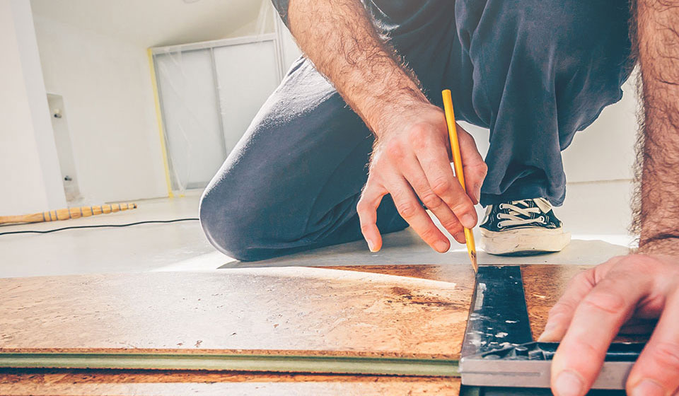 Man measuring his floor