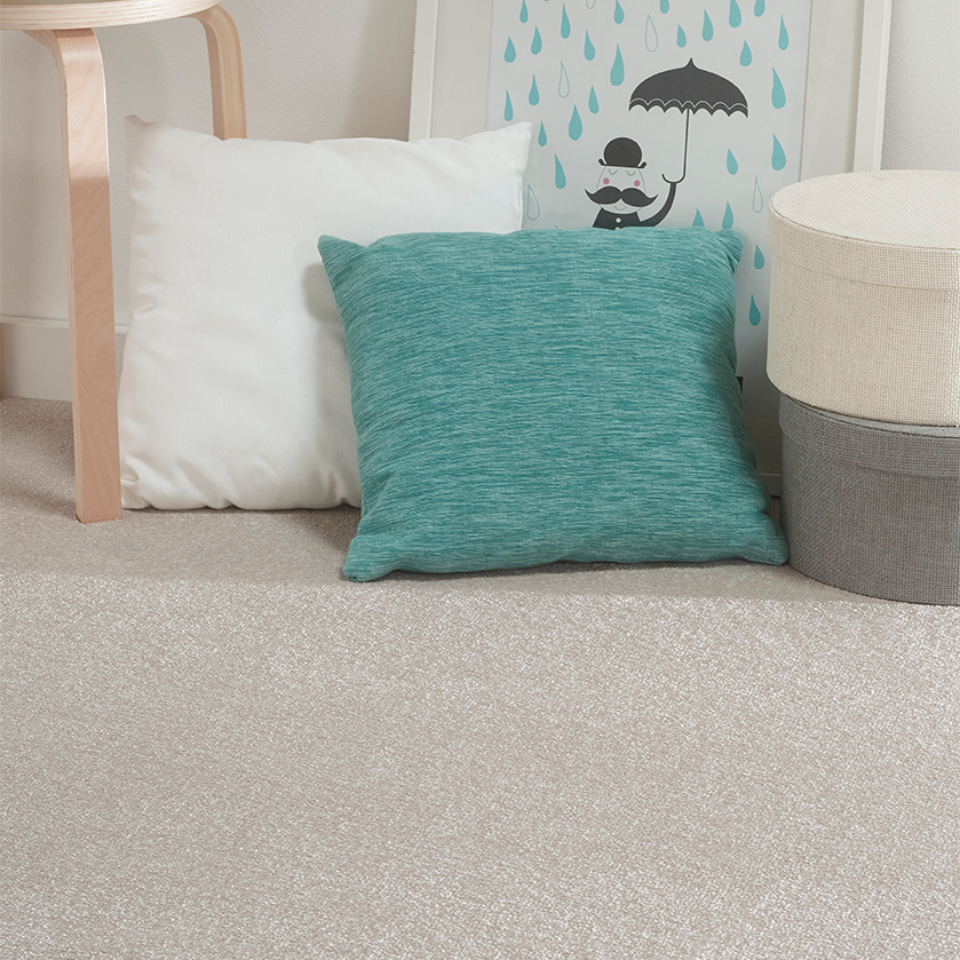 Philadelphia saxony carpet with cushions placed on it in colour flax