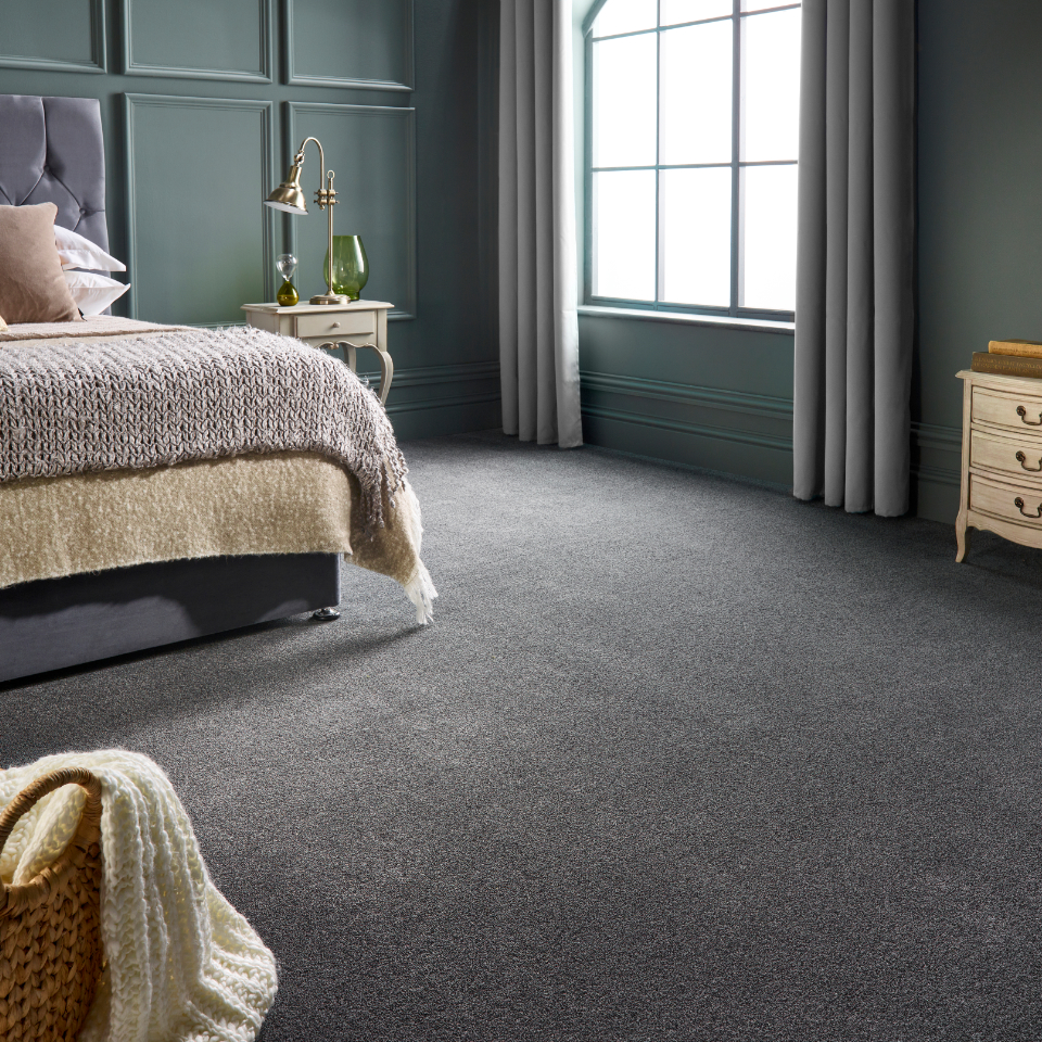 St Davids twist pile carpet in a bedroom with bed decor and a blanket basket