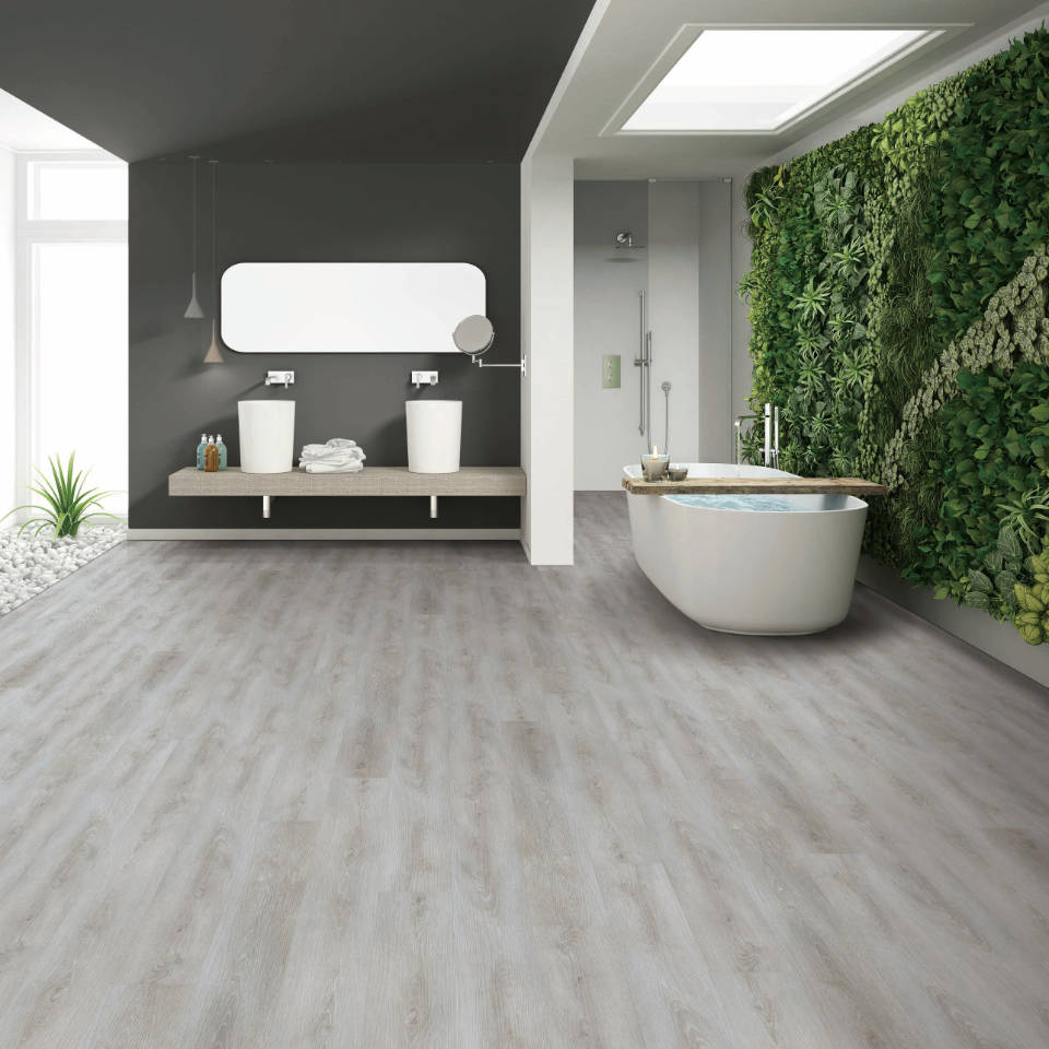 LVT flooring in mordern, spacious bathroom with freestanding bathtub