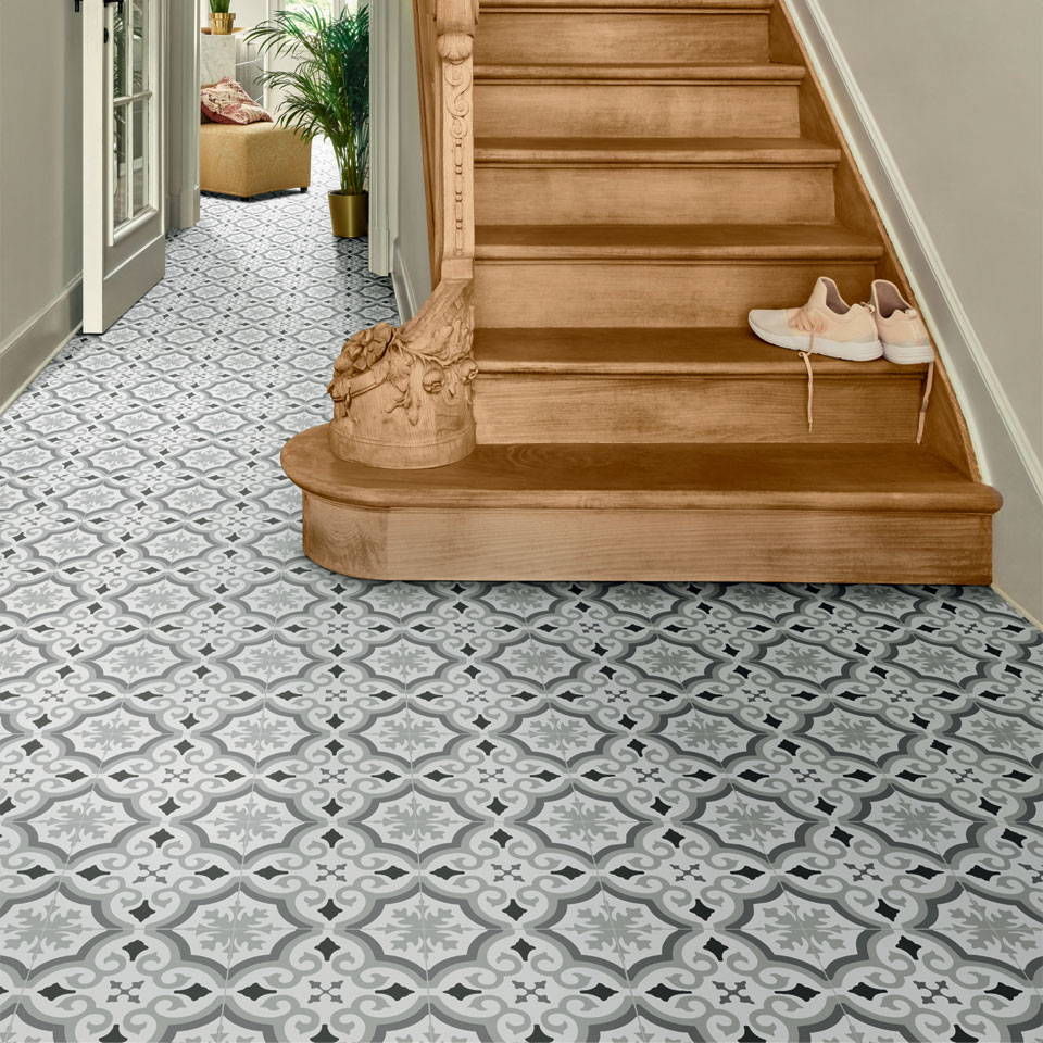 Vinyl flooring in spacious hallway with wooden staircase