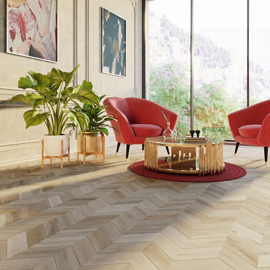 Gorgeous open space with large windows, red armchairs in a seasting area surrounding an art deco coffee tablet on a patterned wood flooring