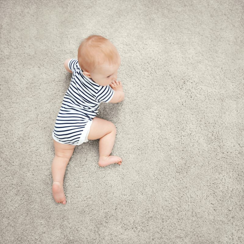 Love saxony carpet in colour Sesame with a baby crawling on it